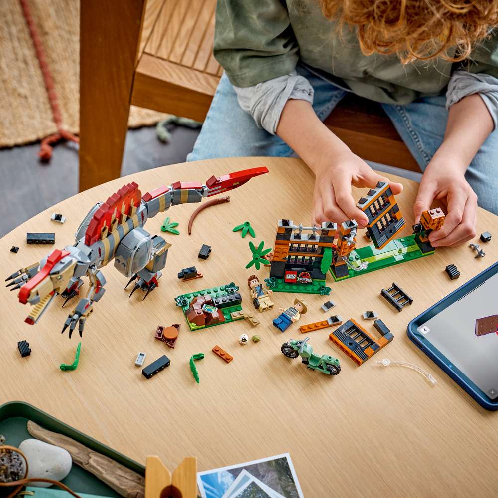 LEGO Jurassic World Spinosaurus Dinosaur Escape 77982 - a child building the set. 820 pieces. Ages 9+.