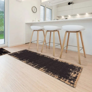 Miabella Runner Mat in black with beige border, 50cm x 150cm, displayed in modern white kitchen with three wooden bar stools and white cushioned seats on light wood flooring