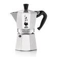 Bialetti Moka Express 6 cup stovetop coffee maker with white aluminum body, black handle and lid, featuring the iconic Bialetti logo of a man with a mustache, made in Italy