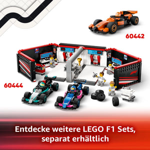 LEGO F1 set 60442 featuring orange McLaren race car, pit garage with red and black details, two turquoise and pink Formula 1 cars, minifigures, trophy, tires and pit crew accessories displayed against white background