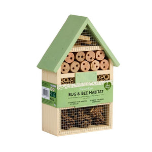 Wooden bug and bee habitat house with green roof and natural wood frame, featuring multiple compartments with bamboo tubes, mesh panels, and straw filling, displayed against white background