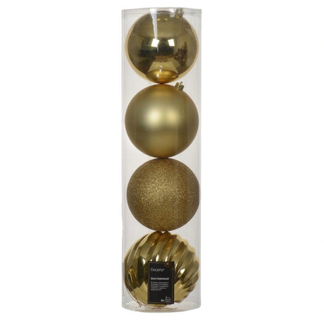 Set of gold Christmas ornaments in a clear cylindrical packaging on a white background
