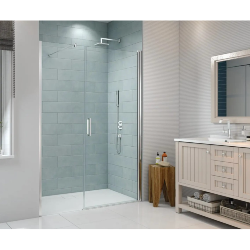 Merlyn 8 Series frameless pivot shower door in chrome finish installed in modern bathroom with light blue subway tile walls, white vanity with timber accents, and contemporary fixtures