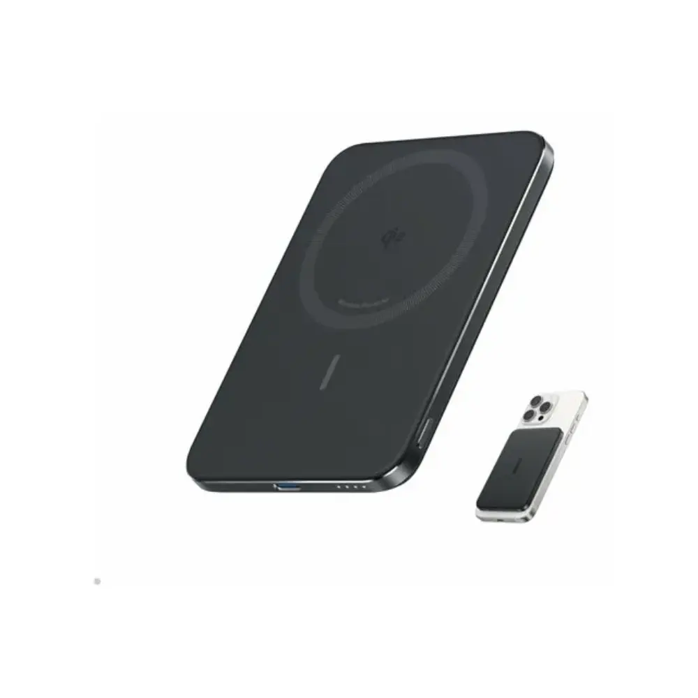 Anker Nano 5000mAh slim power bank in black with MagSafe attachment shown next to iPhone for size comparison