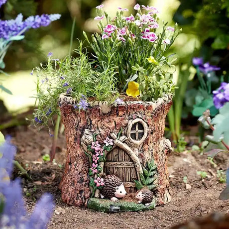 Fairy house made of wood with flowers and small animals on a garden background