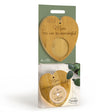 Heart-shaped wooden product with engraved text in a green and white packaging