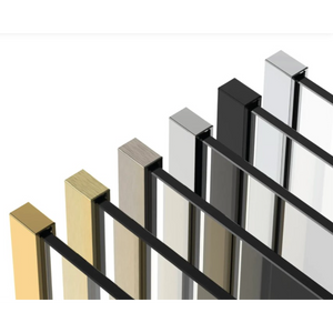 Flair AYO 8mm wetroom panels displayed in a row showing finish options including brushed brass, cream, brushed nickel, matte black, stainless steel and white with black frame profiles in isometric view