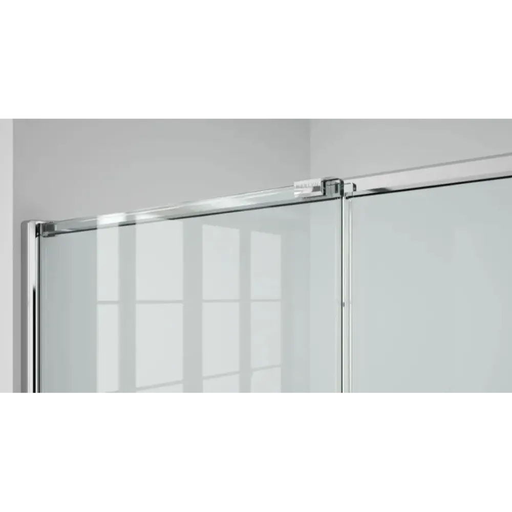 Merlyn ARYSTO Eight sliding shower door in chrome finish with clear glass panels and modern hardware mounted on white bathroom wall