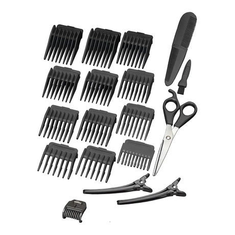 BaByliss men's grooming kit with hair trimmer, scissors, and attachments on a white background