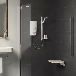 Bathroom with shower setup, including a shower head and control panel on a tiled wall.