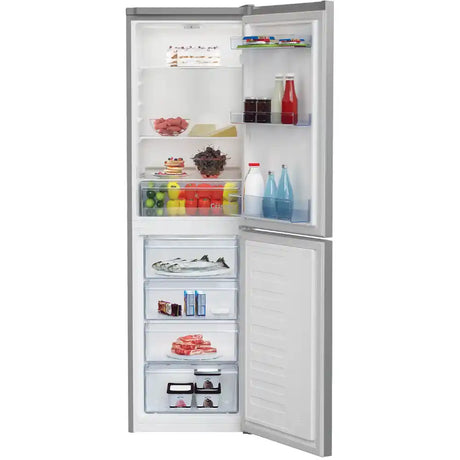 Beko CSG4582S silver 50/50 combi fridge freezer with open doors displaying fresh produce, beverages, frozen fish and meat across multiple shelves and drawers