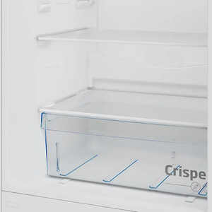 Interior view of Beko CSG4582S combi fridge freezer showing empty white refrigerator compartment with transparent blue-handled crisper drawer and wire shelving