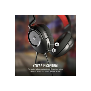 Corsair HS35 v2 gaming headset in black with gray ear cup detail, showing volume wheel and mute button controls with red headband accent, displayed against blurred gaming environment background