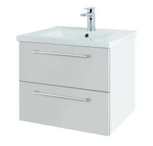 White wall-hung bathroom vanity unit with two drawers, integrated ceramic sink and chrome single-lever tap, contemporary design with horizontal chrome handles