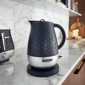 Morphy Richards Cassini 1.7 litre jug kettle in outer space black and stainless steel with hexagonal pattern design on marble kitchen countertop