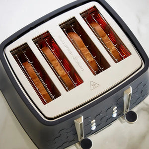 Morphy Richards Cassini 4 slice toaster in black and cream with red heating elements visible through four wide slots, featuring chrome handles and control buttons, displayed from above on white background