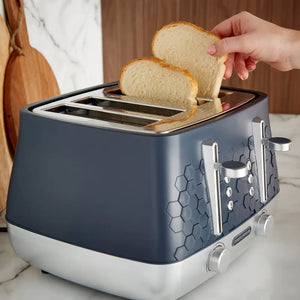 Morphy Richards Cassini 4 slice toaster in grey and white with two slices of toasted bread being removed, showing hexagonal texture detail on the body and chrome accents on a marble countertop