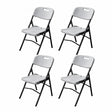 Four white blow moulded folding chairs with black metal frames arranged in a 2x2 grid, featuring carrying handles on the backrest and sturdy leg braces