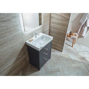 Modern bathroom vanity unit with white ceramic basin and matt carbon finish cabinet featuring three drawers, chrome tap and handles, displayed in contemporary bathroom setting with wood-effect wall tiles and herringbone floor pattern