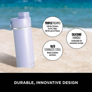 Lavender Ninja Thirsti 700ml insulated travel bottle on beach sand with ocean background, featuring triple thermo technology keeping drinks cold for 24 hours or hot for 12 hours, silicone handle for convenient carrying, and durable 18/8 stainless steel construction resistant to scratches and dents