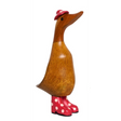 Wooden duck figurine with natural brown wood body, long carved neck, red and white polka dot wellie boots, and matching red hat with white spot, 22cm tall