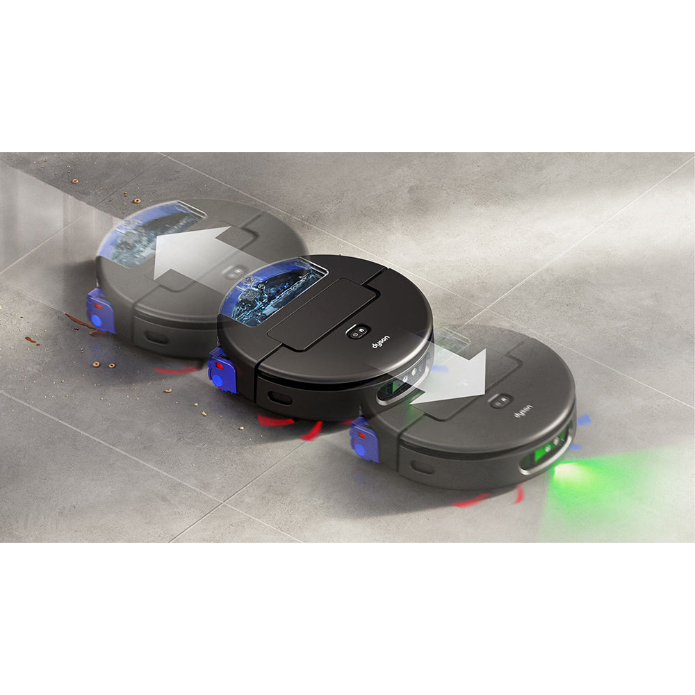 Three black Dyson Spot+Scrub AI robot vacuums lined up on a light gray tile floor, displaying illuminated blue and red laser sensors and green navigation lights, with small screens visible on their tops and white cleaning pads extended underneath