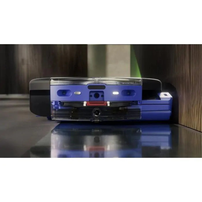 Blue and transparent electronic device on a reflective surface with a blurred background