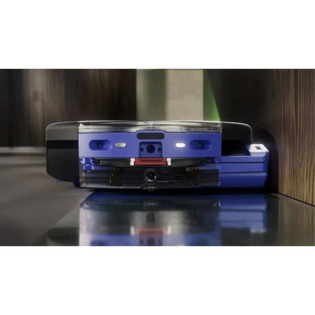 Blue and transparent electronic device on a reflective surface with a blurred background