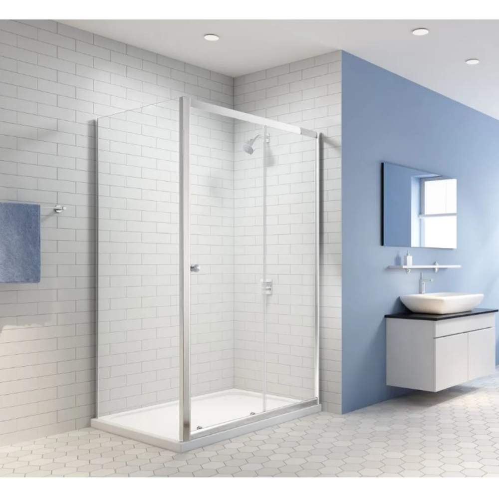 Merlyn Easy Sliding Shower Door in chrome finish with clear glass panels installed in a modern bathroom with white subway tile walls, blue accent wall, white vanity unit with ceramic basin and recessed ceiling lights