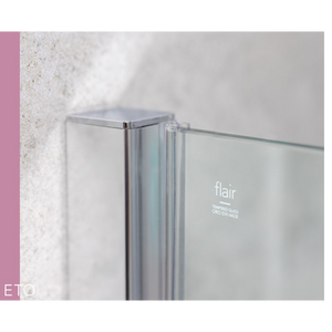 Close-up detail of Flair ETO chrome sliding shower door frame with tempered glass panel against white textured tile wall, showcasing modern minimalist design with polished metal profile and clear glass construction