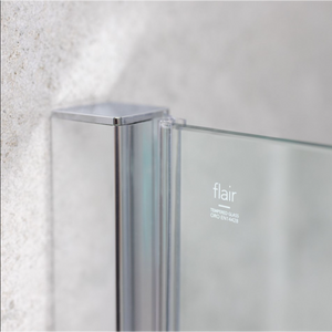 Flair ETO chrome hinge shower door with tempered glass and metal frame mounted on white textured tile wall, showing corner detail and branding