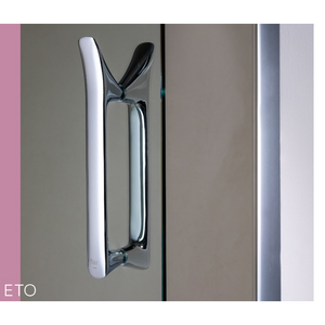 Close-up of chrome and black Flair ETO sliding shower door handle mounted on glass panel, showing modern minimalist design with polished metal finish and dual-tone color scheme
