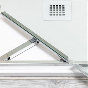 Flair ETO Infold shower door in brushed nickel finish showing hinged glass panel and metal frame hardware against white wall with wooden floor
