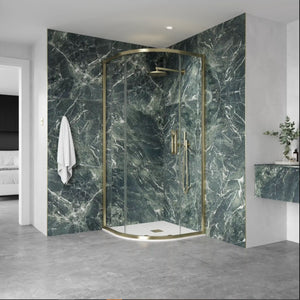 Flair ETO quadrant shower enclosure with brushed brass frame and green marble effect wall panels in modern bathroom setting