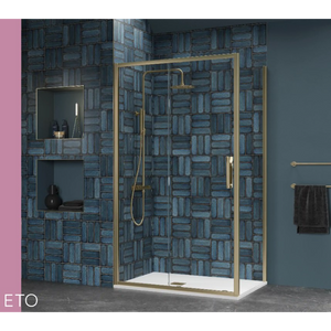 Flair ETO brushed brass sliding shower enclosure with white tray against blue brick tile wall in modern bathroom setting with gold towel rail and pink accent wall