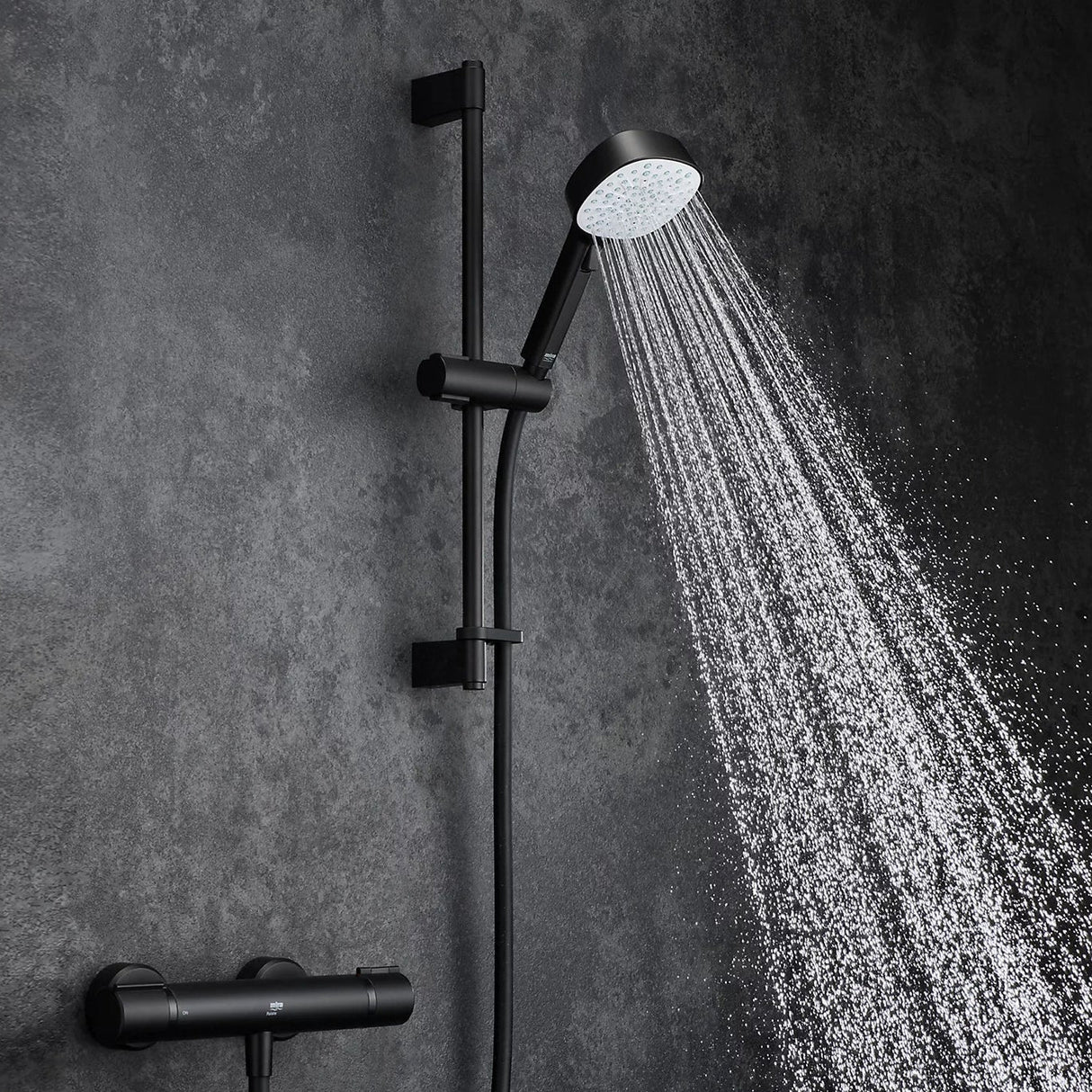 black shower head with hose and control on a white background
