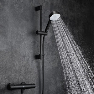 black shower head with hose and control on a white background