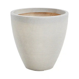 Large stone garden planter with textured horizontal ridged finish in cream white color, tapered cylindrical shape with terracotta interior rim, suitable for outdoor use