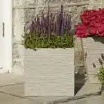 Strata Slate Square Garden Planter Pot in stone with purple lavender and red flowering plants displayed outdoors