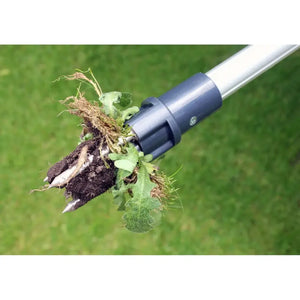 Burgon and Ball Wonder Weed Puller with blue and silver handle removing a dandelion weed with roots and soil from green lawn