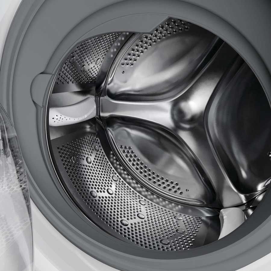 Hoover H-Wash 300 integrated washing machine interior showing stainless steel drum with perforated holes and silver wash tub components on white exterior casing