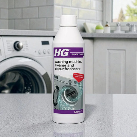 HG Laundry Boom washing machine cleaner and odour freshener 550g bottle displayed on kitchen counter with white washing machine in background
