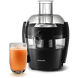 Philips Viva Collection compact juicer in black and stainless steel with 1.5 litre capacity, shown with a glass of fresh orange juice