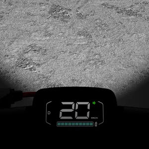 Digital speedometer display of Segway Ninebot Kickscooter E3 Pro showing 20 km/h speed reading on asphalt ground surface