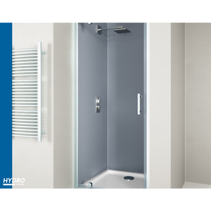 Modern chrome pivot shower door with grey acrylic panels and white frame installed in contemporary bathroom with white walls and towel radiator