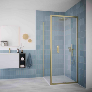 Flair ILI brushed brass bifold shower door installed in modern bathroom with blue vertical tile walls, white vanity, and rainfall showerhead