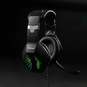 Intempo black gaming headset with green LED lights and microphone, studio product shot against dark background