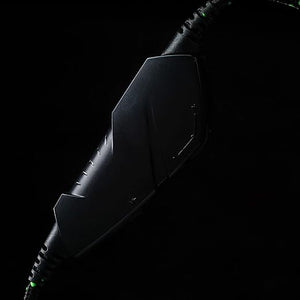 Intempo gaming headset with mic in black and green, shown against black background with illuminated cable connector detail
