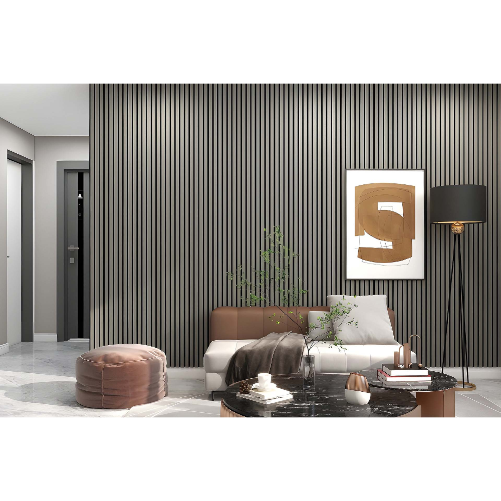 Modern living room interior featuring vertical acoustic wall panels in dark grey installed floor to ceiling, cream sofa with brown leather headboard, pink velvet pouf, black marble coffee table, abstract artwork, potted plant, and contemporary furnishings in neutral tones