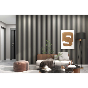 Modern living room interior featuring vertical acoustic wall panels in dark grey installed floor to ceiling, cream sofa with brown leather headboard, pink velvet pouf, black marble coffee table, abstract artwork, potted plant, and contemporary furnishings in neutral tones
